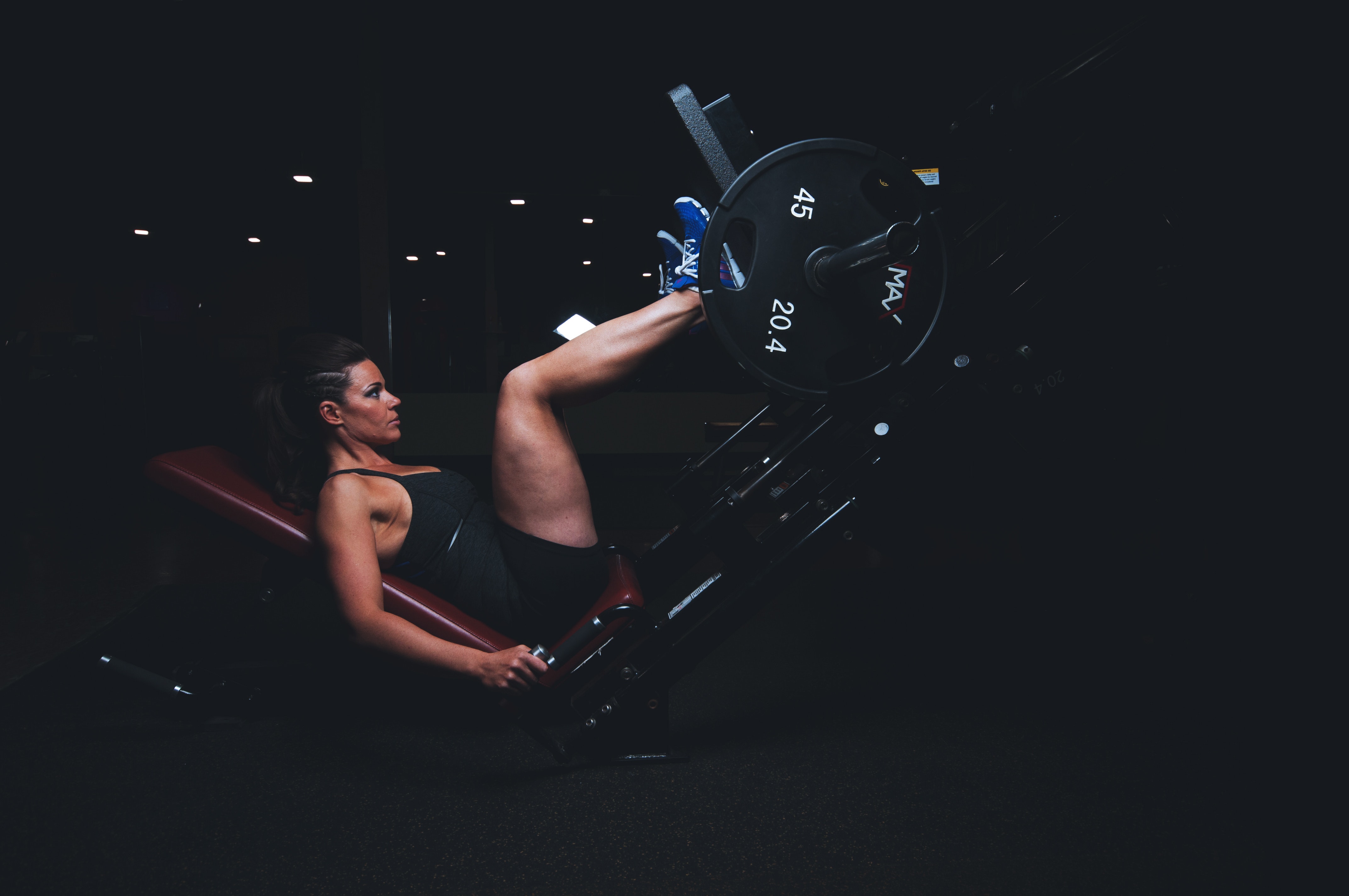 Picture of a woman using a leg press.